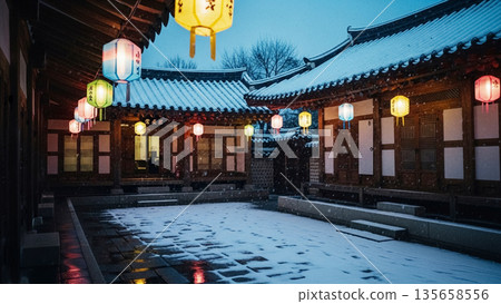 Snowy Winter Evening in a Traditional Korean Hanok Courtyard with Colorful Lanterns and Copy Space 135658556