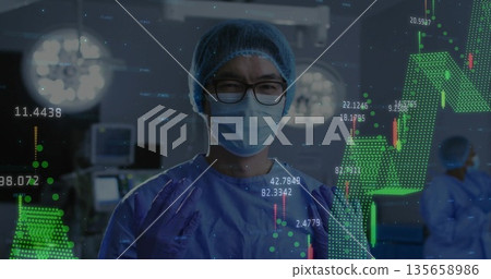Chinese male surgeon in scrubs operating in surgical suite, with candlestick chart overlays 135658986