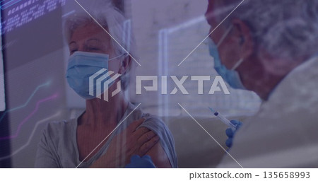 Receiving vaccine woman wearing surgical mask and shirt in clinic, with syringe and blue gloves Receiving vaccine woman wearing surgical mask and shirt in clinic, with syringe and blue gloves 135658993