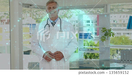 Standing doctor wearing white coat projecting globe hologram at desk in office, with stethoscope 135659152
