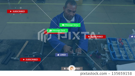 Assembling mature technician fitting metal frame at industrial workbench with social media overlays 135659158