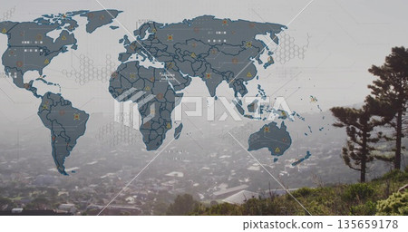 Displaying digital world map overlay floating on grassy hillside, with hex grid and icon markers 135659178