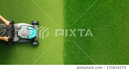 Person using a lawn mower to cut grass in a well-maintained garden, showcasing a clear division between freshly mowed and uncut grass areas Person using a lawn mower to cut grass in a well-maintained garden, showcasing a clear division between freshly mowed and uncut grass areas 135659374