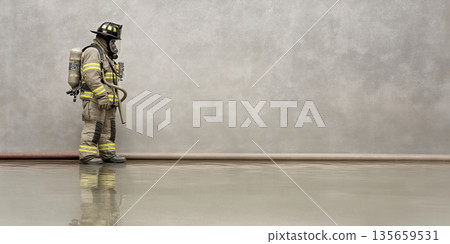 Firefighter in full gear stands beside a wall with reflective floor, holding a hose and wearing a breathing apparatus in a minimalistic indoor environment 135659531