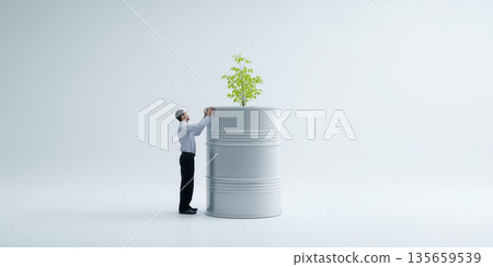 Businessman in formal attire examines a green plant growing from a large white barrel in a minimalistic indoor environment with soft lighting and a clean background 135659539