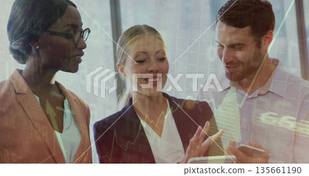 Viewing financial charts, business team collaborating in conference room with tablet and smartphone Viewing financial charts, business team collaborating in conference room with tablet and smartphone 135661190