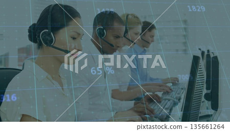 Call center agents handling calls on headsets and operating computers in open office, data overlay Call center agents handling calls on headsets and operating computers in open office, data overlay 135661264