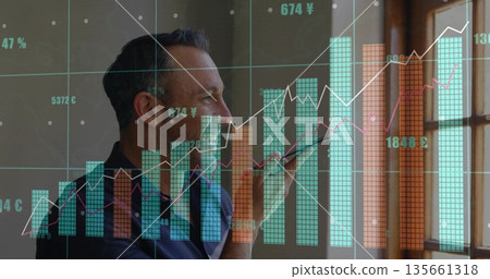 Speaking male professional holding smartphone near mouth at wooden window, with data charts overlay Speaking male professional holding smartphone near mouth at wooden window, with data charts overlay 135661318