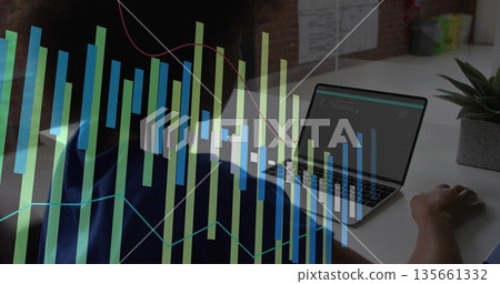 Coding female developer analyzing metrics on laptop at office desk, with data visualization overlay Coding female developer analyzing metrics on laptop at office desk, with data visualization overlay 135661332