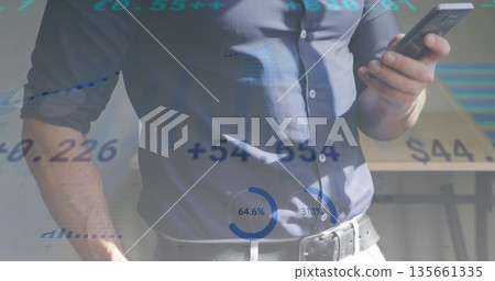 Holding smartphone man in dress shirt checking financial overlays in office, with metal table leg Holding smartphone man in dress shirt checking financial overlays in office, with metal table leg 135661335