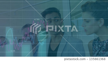 Speaking Indian man in gray blazer presenting financial charts around conference table in office Speaking Indian man in gray blazer presenting financial charts around conference table in office 135661368