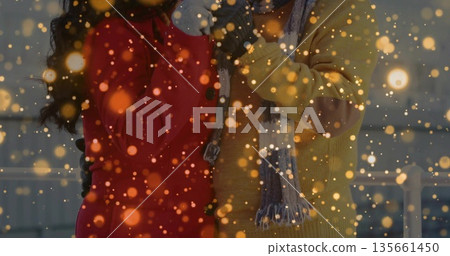 Standing daughter and father wearing coats on rooftop terrace, with metal railing and golden lights Standing daughter and father wearing coats on rooftop terrace, with metal railing and golden lights 135661450