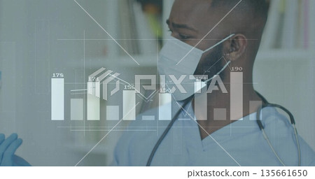 Doctor wearing scrubs analyzing patient metrics in clinic with mask, stethoscope and data overlay Doctor wearing scrubs analyzing patient metrics in clinic with mask, stethoscope and data overlay 135661650