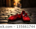 Red ballet flats on cobblestone street, ballet flats rest softly by blurred old town, ballet flats suggest dance memory and city romance, warm light kisses satin and stones, gentle nostalgia mood 135661744
