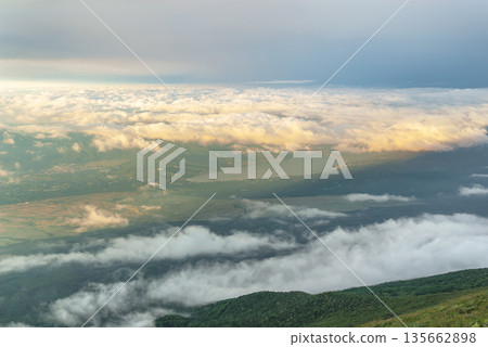 A panoramic view of Lake Yamanaka seen from near the seventh station of Mt. Fuji, and the foot of the mountain enveloped in a vast sea of clouds 135662898