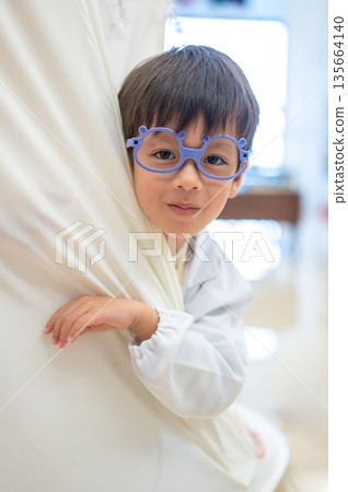 Charming Little Boy Grinning Inside A Play Tent Charming Little Boy Grinning Inside A Play Tent 135664140
