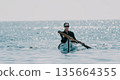 Kayaking Ocean Water Sport - Woman paddling in a kayak on the ocean during a calm day. 135664355
