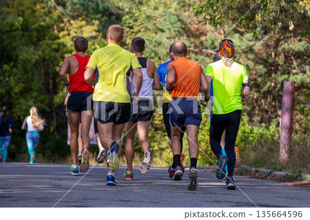 Group male runners running 135664596