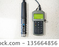 Field pH meter or conductometer with electrode on laboratory table for water analysis.  135664856