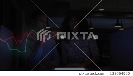 Analyzing market trends two professionals studying tablet in office, holographic line chart overlay Analyzing market trends two professionals studying tablet in office, holographic line chart overlay 135664990