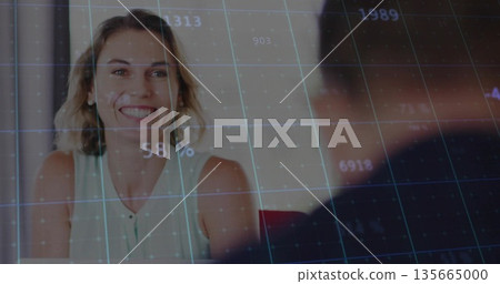 Reviewing data, woman in sleeveless blouse sitting in meeting room with digital grid overlay Reviewing data, woman in sleeveless blouse sitting in meeting room with digital grid overlay 135665000
