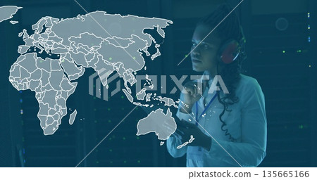 Operating interface engineer wearing red headset among server racks with map overlay, copy space Operating interface engineer wearing red headset among server racks with map overlay, copy space 135665166