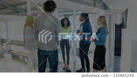 Brainstorming team standing in modern loft office, with glass partition sticky notes and coffee cup 135665248