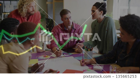 Leading woman in green sweater presenting charts with colored markers in open office, copy space Leading woman in green sweater presenting charts with colored markers in open office, copy space 135665253