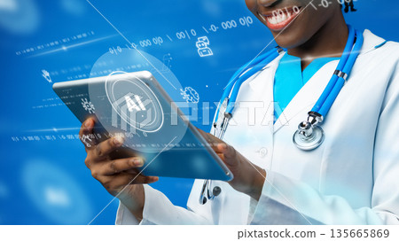 Doctor using tablet for healthcare tasks with digital data displayed on screen 135665869