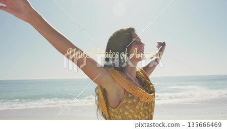 Woman stretching arms toward sun on beach, with yellow sundress, gold United States of America text Woman stretching arms toward sun on beach, with yellow sundress, gold United States of America text 135666469