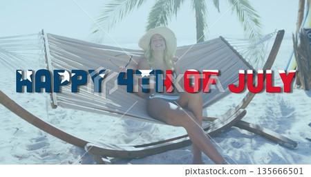 Reclining woman in straw hat striped swimsuit on beach hammock with HAPPY 4TH OF JULY overlay Reclining woman in straw hat striped swimsuit on beach hammock with HAPPY 4TH OF JULY overlay 135666501