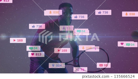 Displaying athlete in red sportswear gripping tennis racket in studio with floating media icons 135666524