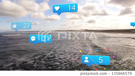 Displaying rolling ocean waves at beach, featuring bright blue social media engagement icons 135666579