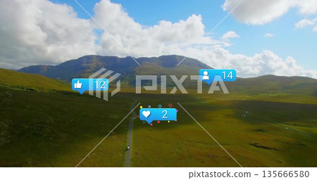Showing sweeping aerial view of highland valley, with road, vehicle and social media reaction icons Showing sweeping aerial view of highland valley, with road, vehicle and social media reaction icons 135666580