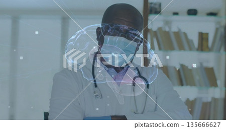 Analyzing holographic brain in clinic, doctor wearing lab coat mask with stethoscope file shelves Analyzing holographic brain in clinic, doctor wearing lab coat mask with stethoscope file shelves 135666627