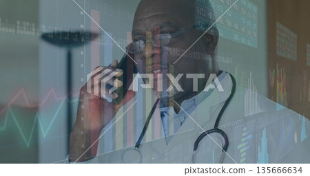 Senior doctor wearing stethoscope talking into smartphone in medical office, showing data overlays 135666634