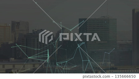 Overlaying network spreading across office tower skyline on rooftop, with glowing lines and nodes 135666650