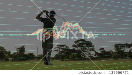 Male golfer wearing cap swinging golf club in fairway, with golf ball on tee, data overlay Male golfer wearing cap swinging golf club in fairway, with golf ball on tee, data overlay 135666771