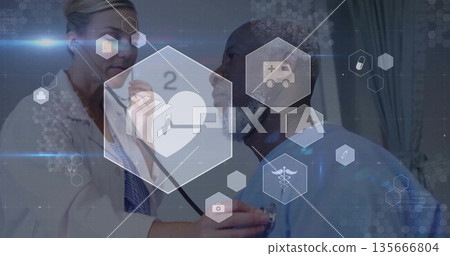 White woman doctor using stethoscope on Black male patient in clinic featuring hexagonal overlays 135666804