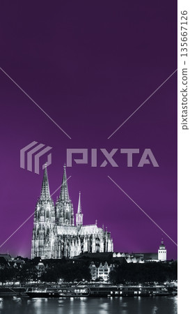 Cologne, Germany. Night View Of Cologne Cathedral. Catholic Gothic Cathedral In Night. UNESCO World Heritage Site. Toned Photo Black, White And Ultra Violet Colors 135667126