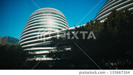 Beijing, China. Galaxy SOHO is an urban complex building located in Beijing, China. Built between 2009 and 2012, it is the first of three buildings designed by Iraqi-British architect Zaha Hadid 135667164