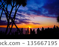 Okinawa People looking at the beautiful sunset Romantic coast 135667195