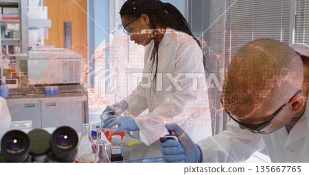 Pouring Black woman in lab coat transferring orange solution at laboratory bench, with flask Pouring Black woman in lab coat transferring orange solution at laboratory bench, with flask 135667765