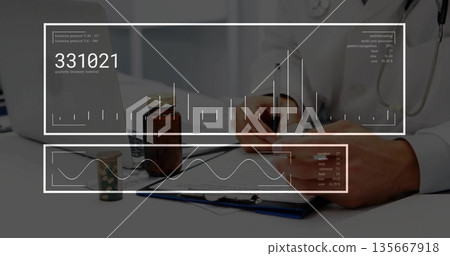 Writing doctor in lab coat with stethoscope filling out chart in doctor's office, with pill jars 135667918