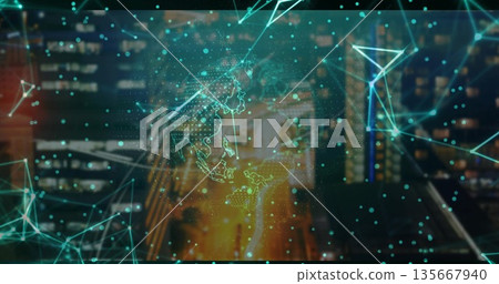 Holographic network hovering over street at night, glowing digital nodes, lines outlining world map 135667940