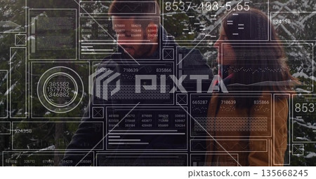 Reviewing bearded data expert and female analyst examining data grids in forest, with floating HUD 135668245