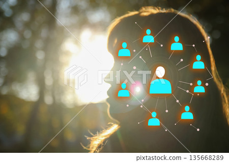 connectivity, communication, or neural networks. silhouette of a person profile against a bright, sunlit forest background. hr concept 135668289