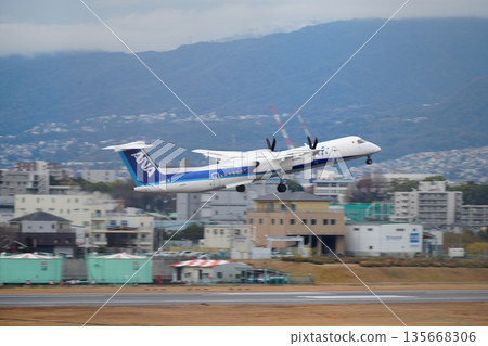 Propeller plane taking off (ANA) Propeller plane taking off (ANA) 135668306