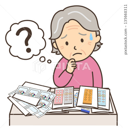 An elderly woman looks troubled by the large number of medicines she has 135668311