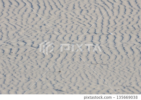 Sand ripples created by strong coastal winds Sand ripples created by strong coastal winds 135669038